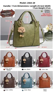 Detail view of macaron bucket bag with dimensions 29.5cm and plush cloud charm decor