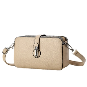 Beige litchi grain leather crossbody bag with double zipper and silver metal twist lock
