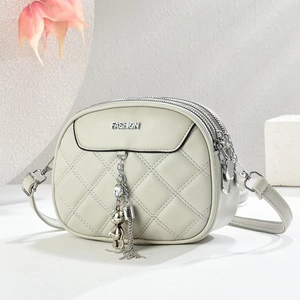 Quilted crossbody bag with three zippers, fashion metal logo, and bear pendant charm