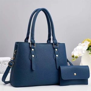 Detail of dark blue lychee grain leather tote bag set with detachable long shoulder strap