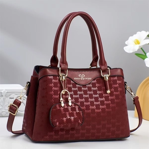 Elegant burgundy tote bag with letter patterns, gold hardware and a small coin purse