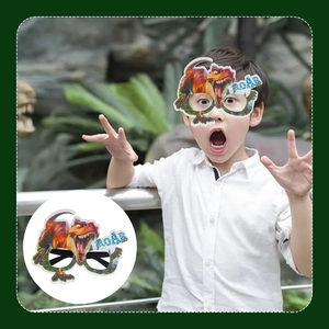 Detail showing an orange dinosaur T-Rex felt glasses frame with ROAR text for party fun