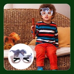 Detail of Tyrannosaurus dinosaur theme paper glasses for kids birthday party photography