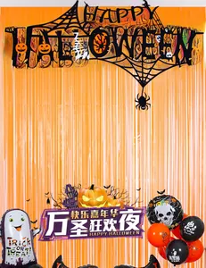 Halloween party set with orange fringe curtain, black letter banner and ghost balloons