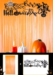 Detail view of orange foil fringe curtain and black Boo Halloween felt banner decorations