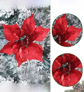 Detailed view of red artificial poinsettia flower with glitter petals for Christmas decor