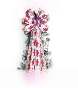 Detail of red white and blue patriotic bow with flag and truck prints on a Christmas tree