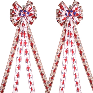 Patriotic Christmas tree bows with red truck and American flag patterns for festive decor