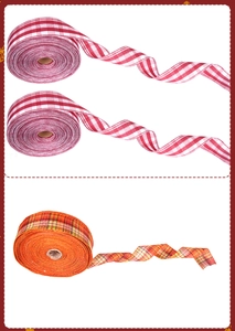 Detailed view of three rolls of plaid burlap ribbons for Christmas DIY tree decorations