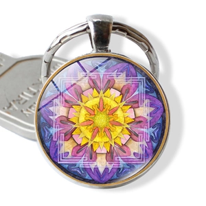 Detailed close-up of mandala floral glass cabochon keychain with silver metal ring