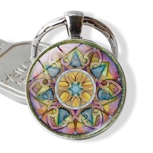 Detailed close-up of a colorful mandala glass pendant with a silver alloy keychain base