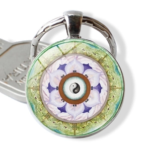 Mandala keychain with Yin Yang Tai Chi pattern and purple lotus flower petals