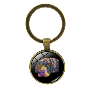 Bronze keychain featuring colorful pop art Labrador retriever dog on black background