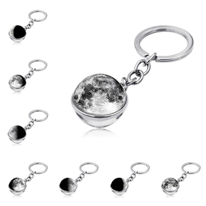 Double-sided moon phase glass ball keychain in stainless steel with realistic textures