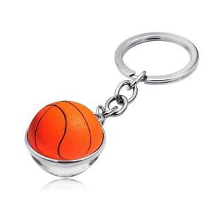 Detail of orange basketball keychain with realistic black texture and silver metal ring