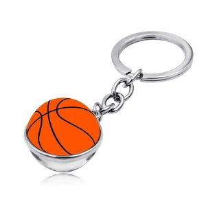 Macro detail of a 3D orange basketball keychain with silver metal ring and chain