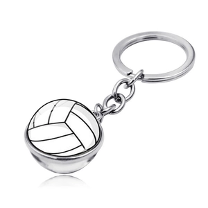 Detailed view of volleyball glass cabochon pendant with silver metal keychain and reflection