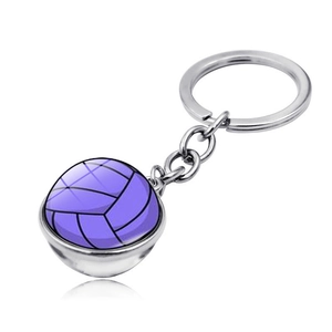 Detail of a purple volleyball keychain with double-sided glass dome and silver metal ring