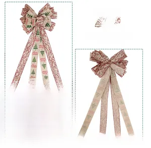 Detail of Christmas tree bow topper with burlap texture and Merry Christmas ribbon