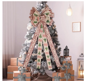 Large beige linen Christmas tree topper bow with red berry and green tree patterns