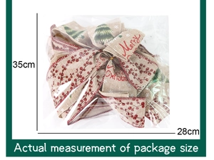 Detailed view of Merry Christmas burlap bow in plastic packaging with 35cm size measurement