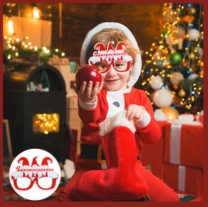 Detailed view of child wearing Christmas party glasses with festive red and white design