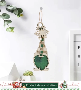Detail of wooden Christmas gnome ornament with green plaid hat and snowflake cutout
