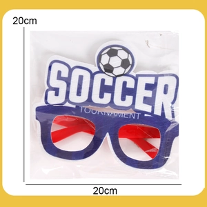 Macro detail of soccer party glasses in individual clear packaging showing the soccer theme