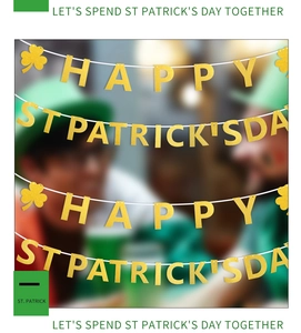 Detail of St. Patrick's Day golden glitter banner with shamrocks for festive party decor
