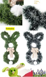 Detail of foldable Easter bunny wreath with green grass texture and brown polka dot bow