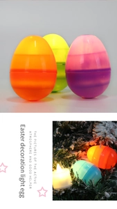 Detail of colorful LED glowing Easter eggs nestled in snow with festive pine needles