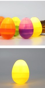 Detailed close-up of colorful LED glowing Easter eggs in matte translucent finish