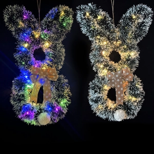 Osterhasen-Girlanden aus Lametta mit LED-Lichtern und gepunkteten Schleifen für Wände