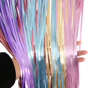 Detailed view of colorful matte and shiny tinsel curtains for party backdrop decoration