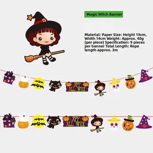 Detail view of paper Halloween banner featuring cartoon pumpkins, witches, and black cats
