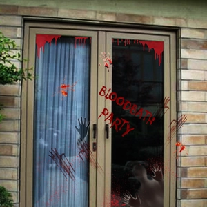 Detail of bloody handprints and Bloodbath Party decals on a glass door for Halloween