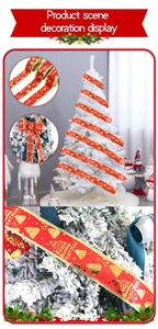 Macro detail of red Christmas ribbon with gold foil joy greetings and bow design