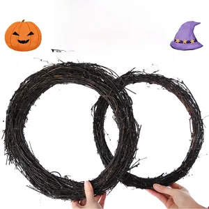 Detail of two black rattan wreaths in different sizes for Halloween home decor base