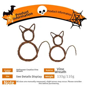 Detail of two handmade cat-shaped natural rattan wreaths for Halloween DIY party decor
