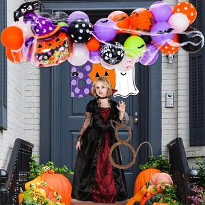 Halloween party kit with colorful balloons, spider decorations and child vampire dress