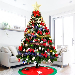 Detailed Christmas tree featuring a gold star topper and festive red bow ornaments