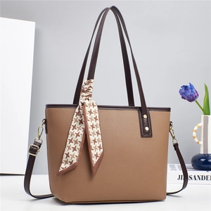 Brown lychee leather bucket bag with houndstooth silk scarf and adjustable strap