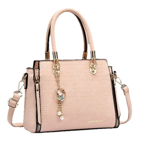 Pink croc-effect satchel bag with top handle, crossbody strap, and bunny charm