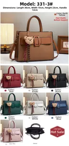 Detailed view of women's tote bag size 30x10x23cm with bear charm and texture detail