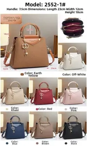 Detailed multi-layer interior and elegant gold handles of this canvas texture handbag