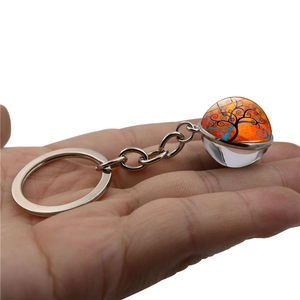 Handheld silver alloy keychain with double-sided glass ball featuring a Tree of Life motif