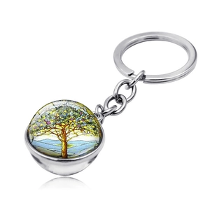 Detailed view of the double-sided glass tree of life keychain with silver alloy plating