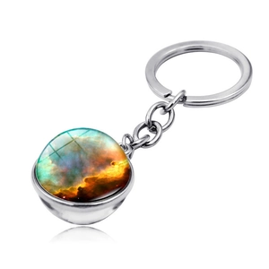 Detailed view of silver galaxy glass ball keychain showing blue nebula pattern and ring