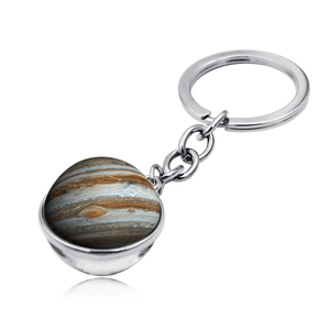 Detailed view of galaxy planet keychain featuring double-sided glass orb with Jupiter pattern