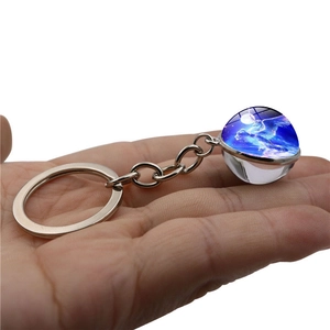 Handheld fantasy unicorn double-sided glass ball keychain with blue starry moon design